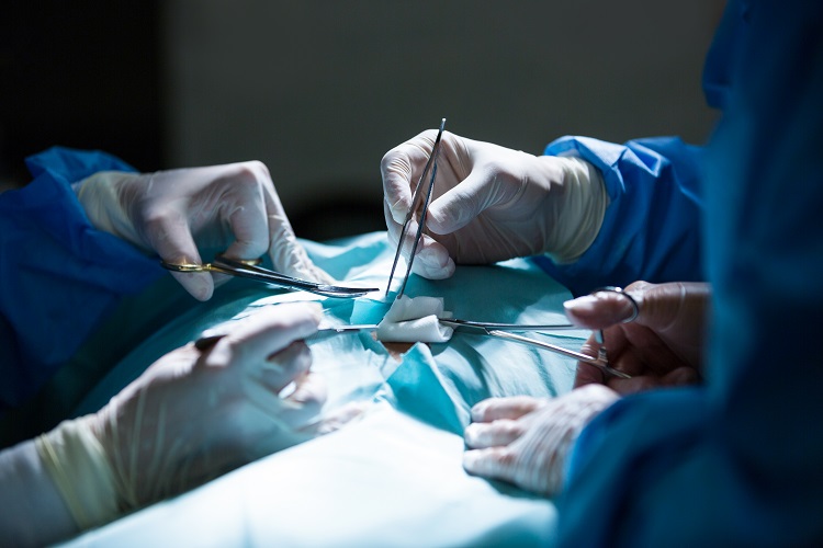 Surgeons performing operation in operation room at the hospital